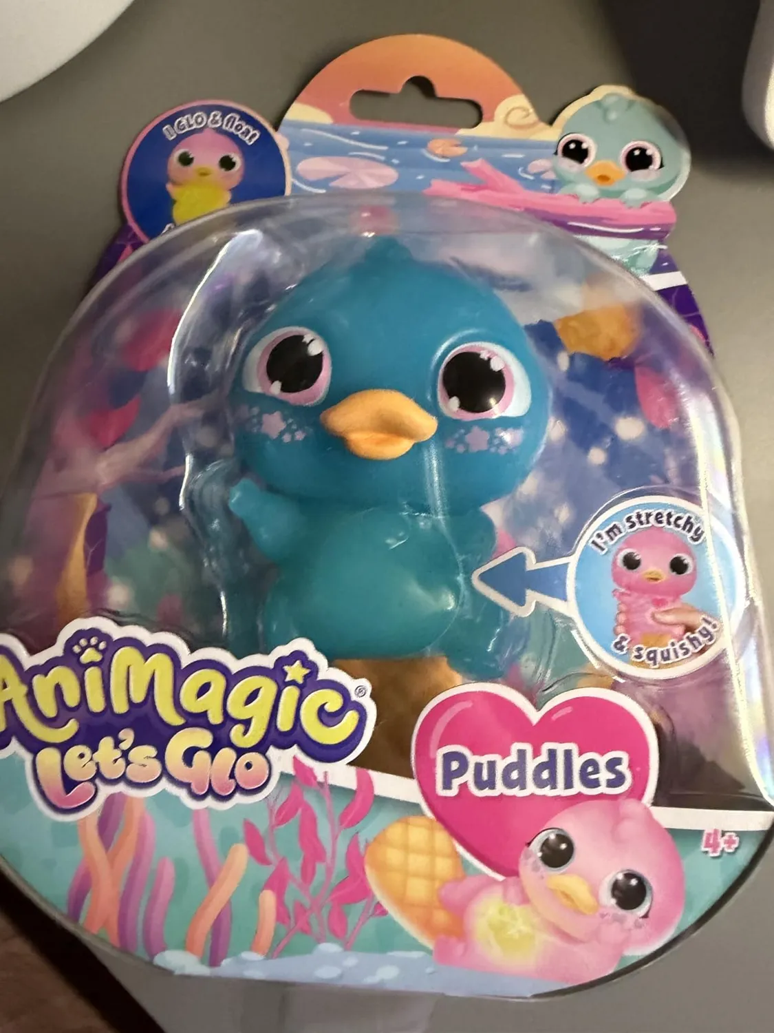 Animagic Let's Glo Puddles Rosa peluche sensoriale luminoso